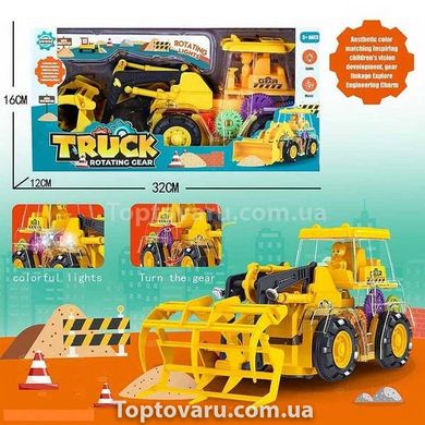 Іграшка Трактор навантажувач з прозорим корпусом з підсвічуванням та звуком Truck Rotating Gear Жовтий 15321 фото