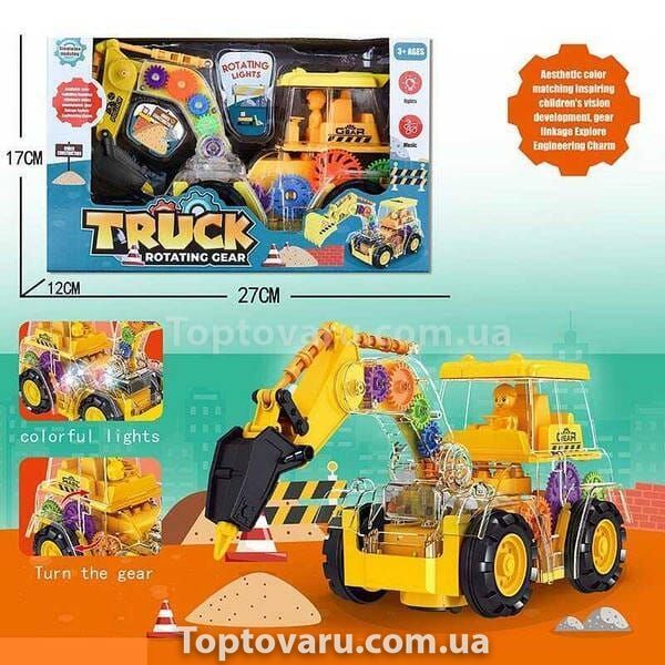 Игрушка Трактор Гидромолот с прозрачным корпусом с подсветкой и звуком Truck Rotating Gear Желтый 15323 фото